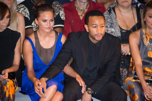 Chrissy Teigen and John Legend hand by hand